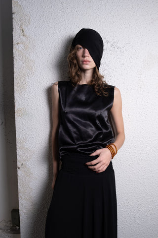 Skin cut satin tank top with spiked nipples